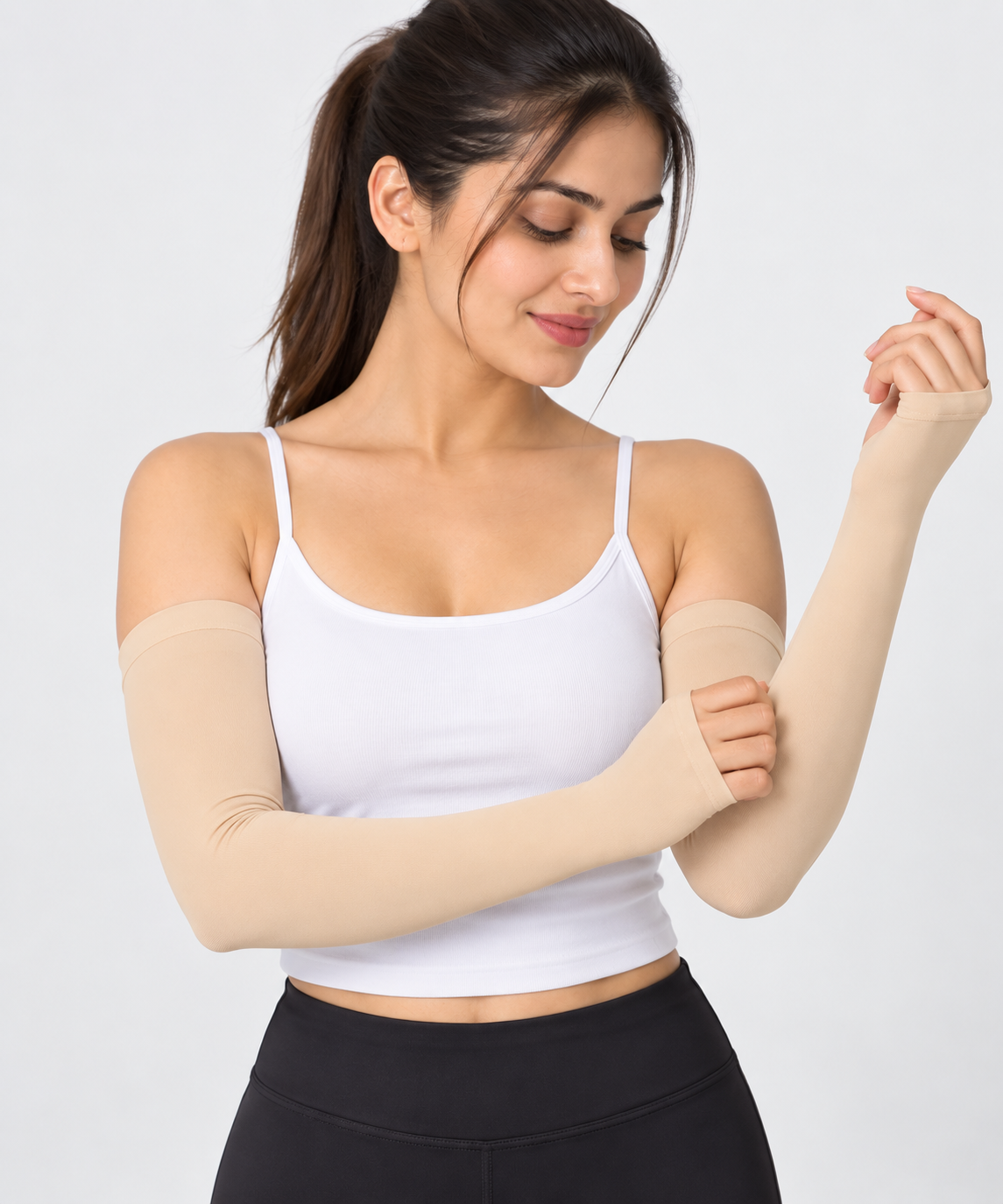 Beige arm sleeves for women worn with a white top