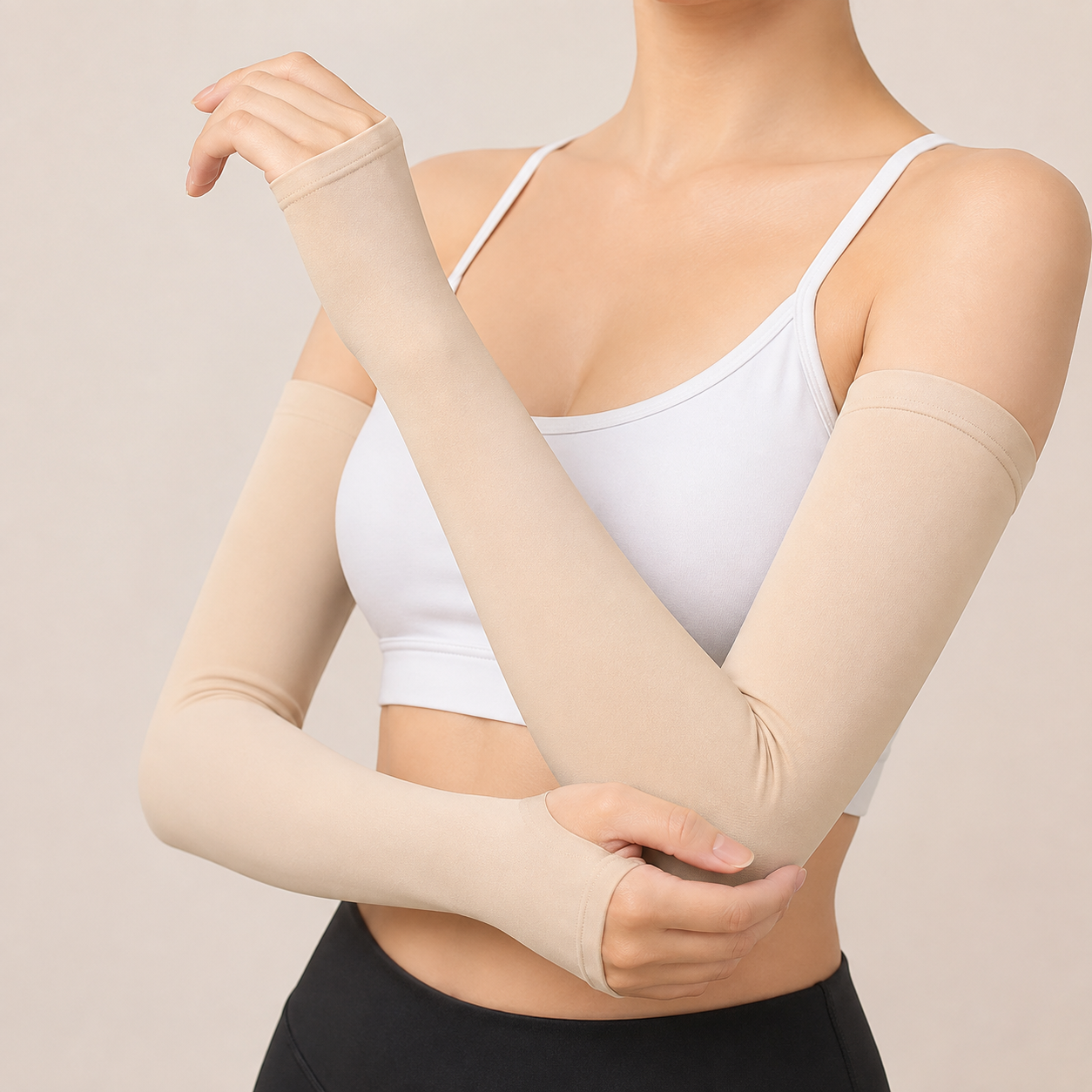Beige UV protection arm sleeves with thumb holes worn by a woman