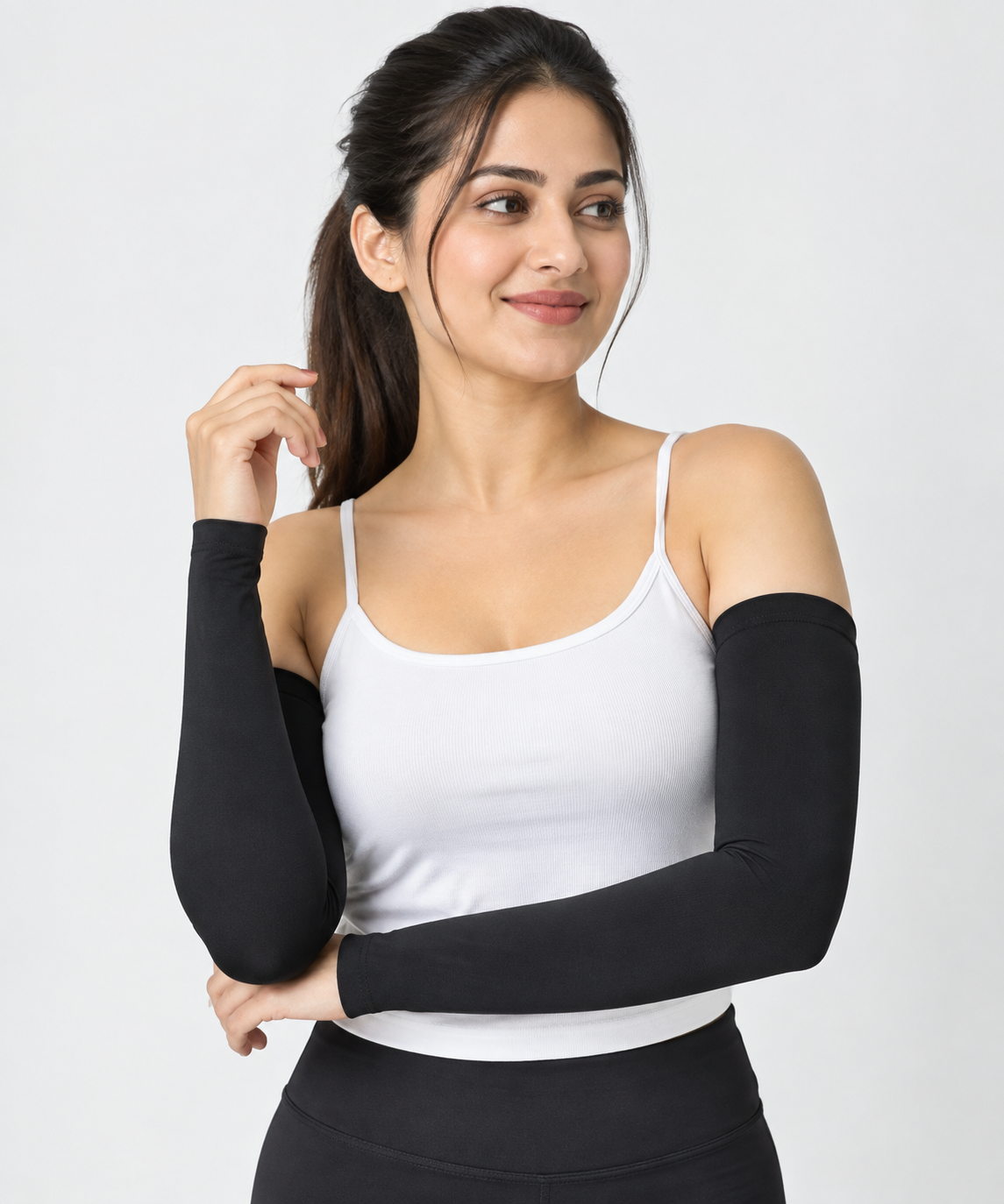 Black arm sleeves for women worn with a white top
